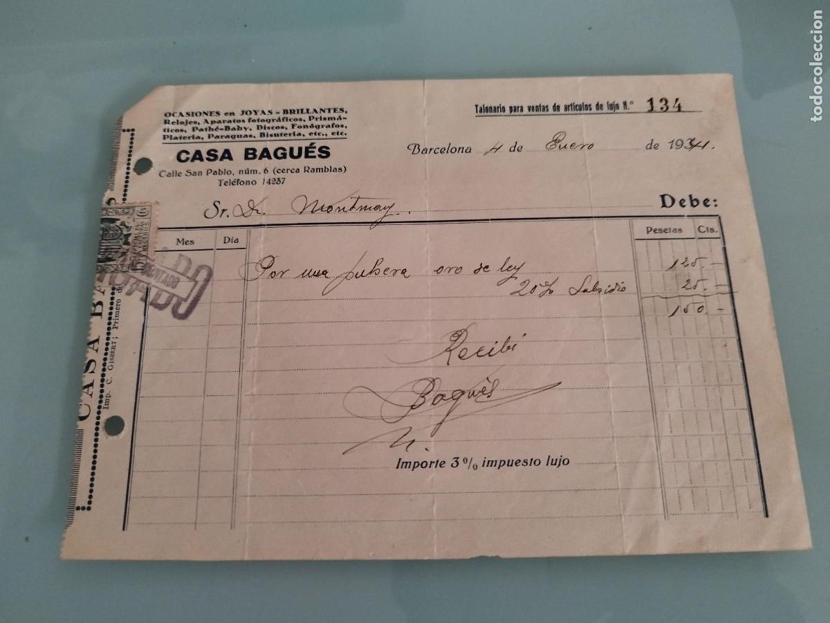 Facturas antiguas: Antiguo factura de Casa Bagu&eacute;s en Barcelona data de 1934. Impuesto de lujo.