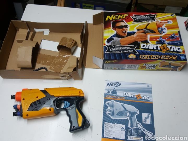 Actionfiguren: Pistola lanza dardos de goma Nerf Dart Tag en caja con instrucciones