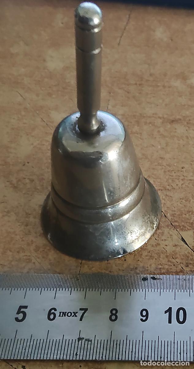 Figuras de acci&oacute;n: Campana de mano de alpaca. - Foto 1