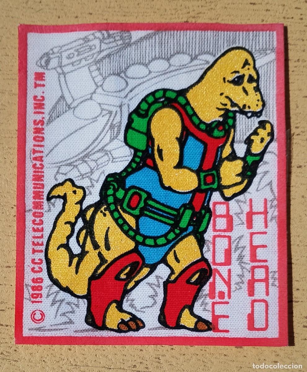 Figuras de acci&oacute;n: Parche Termoadhesivo Bonehead Dinosaucers Dinoplativolos