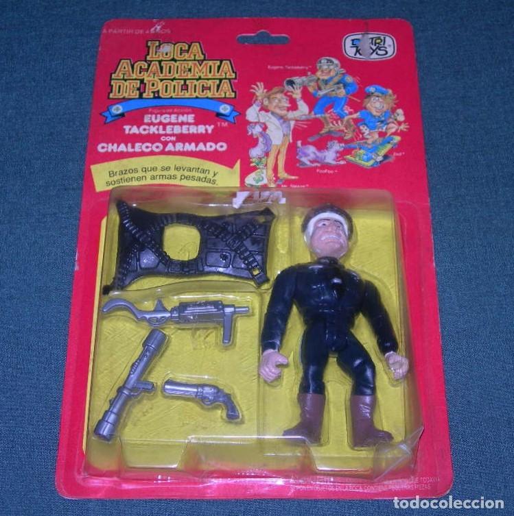 Figuras de acci&oacute;n: FIGURA EUGENE TACKLEBERRY - LOCA ACADEMIA DE POLIC&Iacute;A - SIN USO EN BLISTER - DISTRI TOYS -