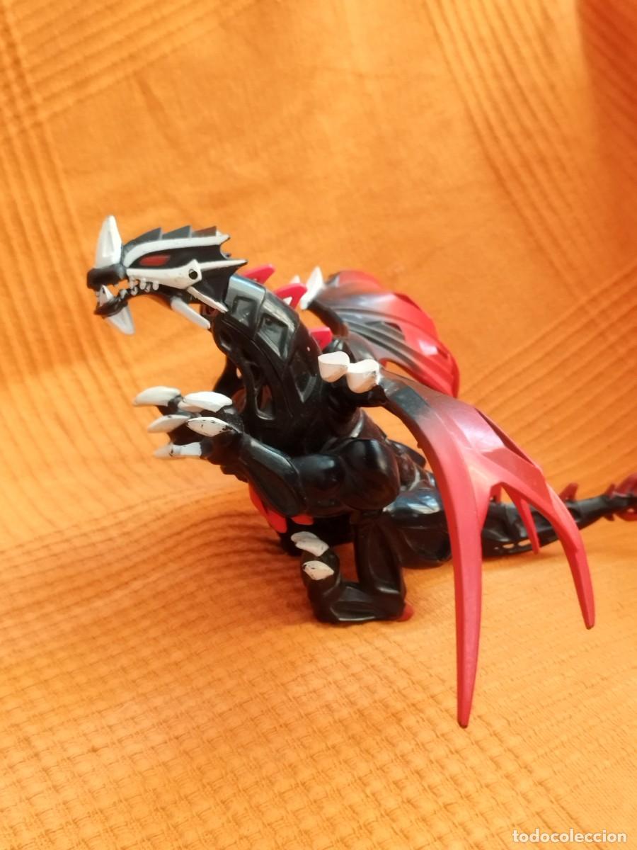 Figuras de acci&oacute;n: figura del drag&oacute;n Blackheart de la l&iacute;nea Mega Bloks Dragons Universe.