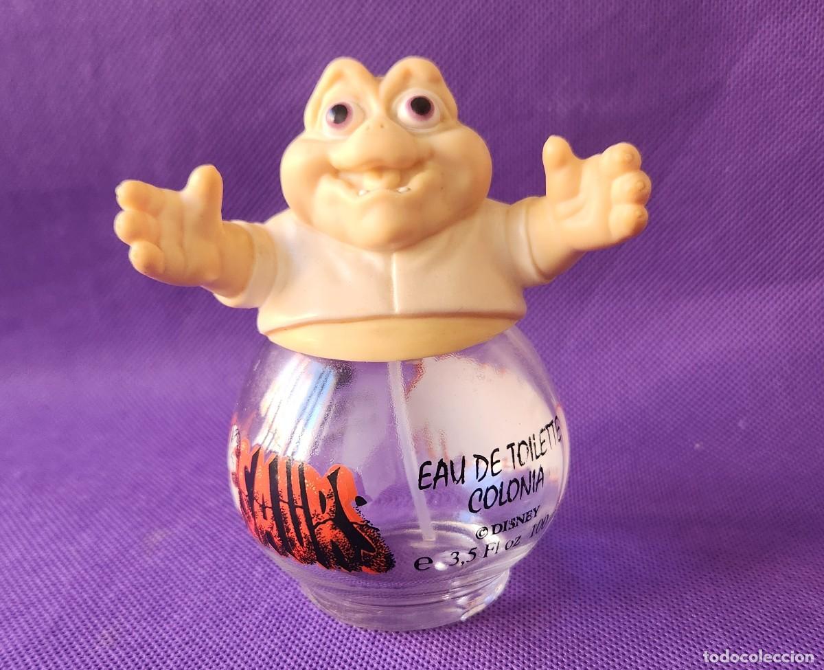 Figuras de acci&oacute;n: BABE SINCLAIR botella VACIA de perfume con figura de goma Disney's DINOSAURS vintage ESPA&Ntilde;A