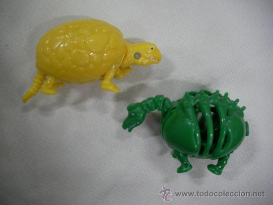 Figuras de goma y PVC: DOS DINOSAURIOS TRANSFORMERS - Foto 1
