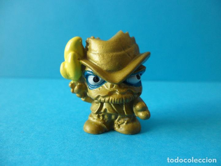 Figure di Gomma e PVC: Figura Zomlings Adventure Series - Kramer Dorado - MBI