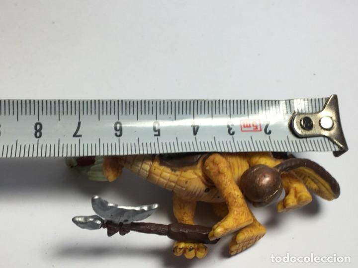 Figuras de goma y PVC: FIGURA DINOSAURIO CON ARMA - Foto 3