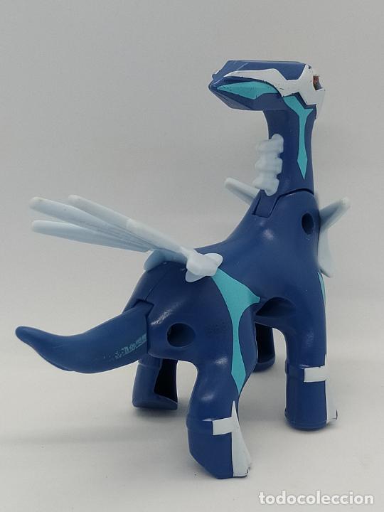 Foto de Modelo Plástico De Um Brinquedo De Pokemon Dialga Da Refeição Feliz  De Mcdonald S Em Um Fundo Azul e mais fotos de stock de Pokémon - iStock