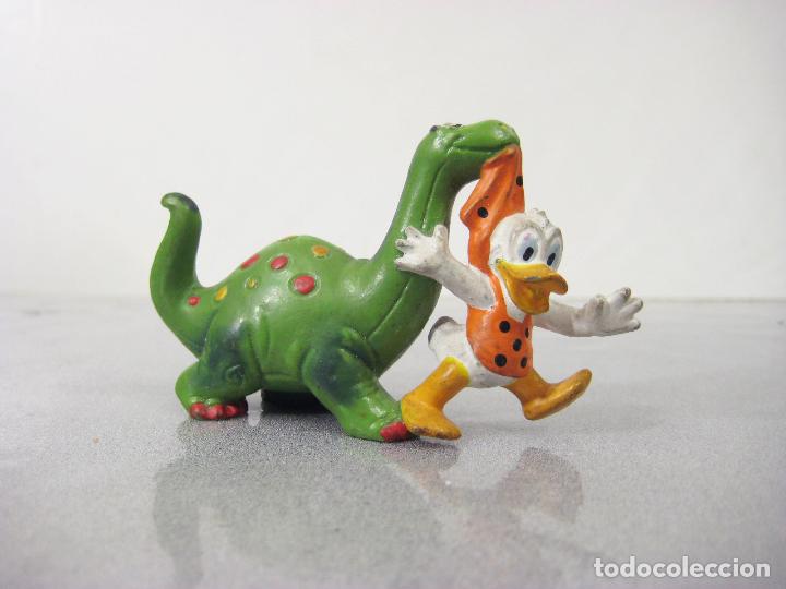 figura de pvc de bebe pato donald con un dinosa - Compra venta en  todocoleccion