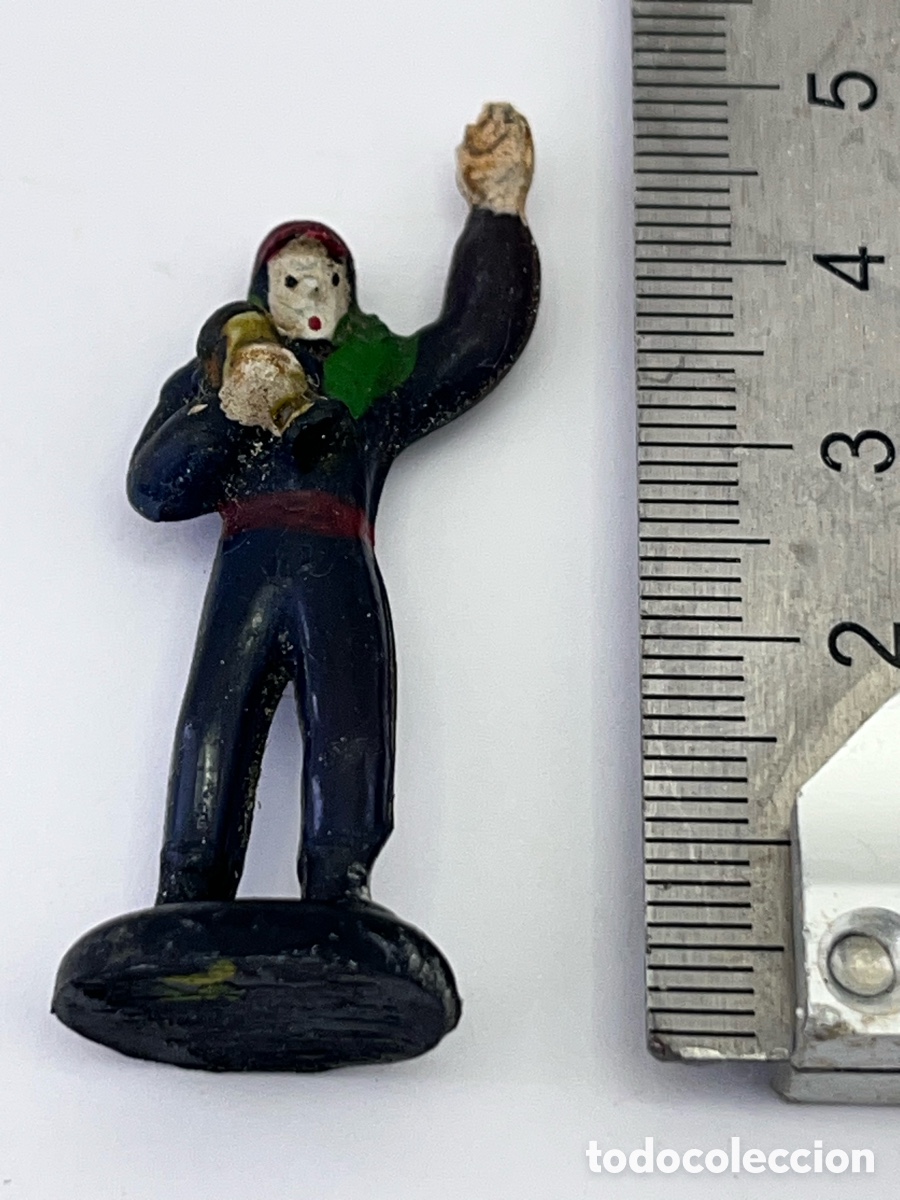 Gummi- und PVC-Figuren: Figurita de ganador de alguna carrera