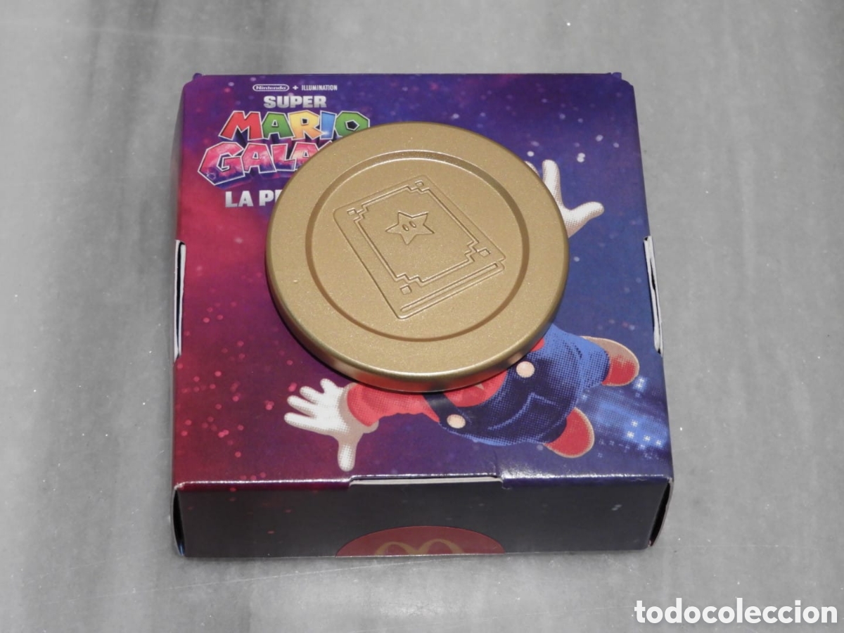 Figuras de Goma y PVC: Moneda Dorada Super Mario Galaxy McDonald's 2026 - Edici&oacute;n Libro de Estela
