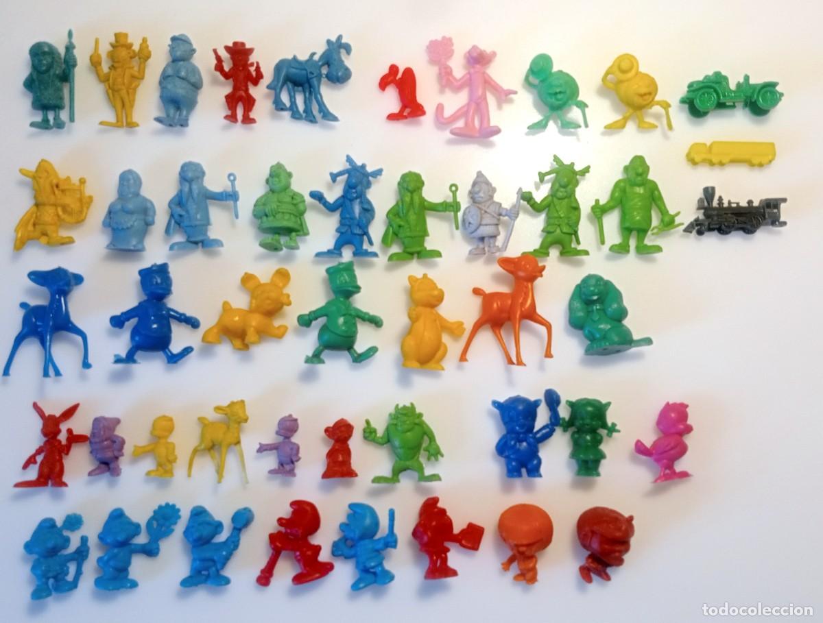 Figuras de goma y PVC: LOTE DUNKIN SERIE ASTERIX, LUCKY LUKE, DANONE COPRAN LOS PITUFOS DISNEY CABEZONES PANTERA ROSA ETC