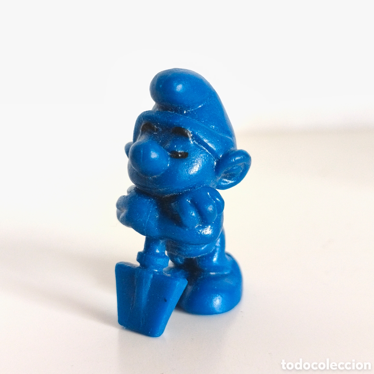 Figuras de goma y PVC: Pitufo perezoso con pala, en bruto, completamente azul , Marca Waldbauer - Pitufo publicitario, 1974