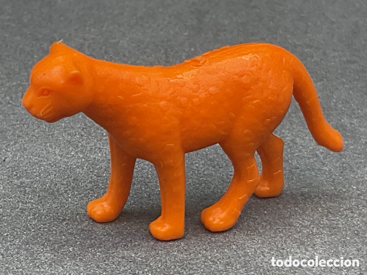 Figuras de goma y PVC: Figura Dunkin . Colecci&oacute;n Fieras del zoo. Color Naranja. Promocionales Chicles Dunkin