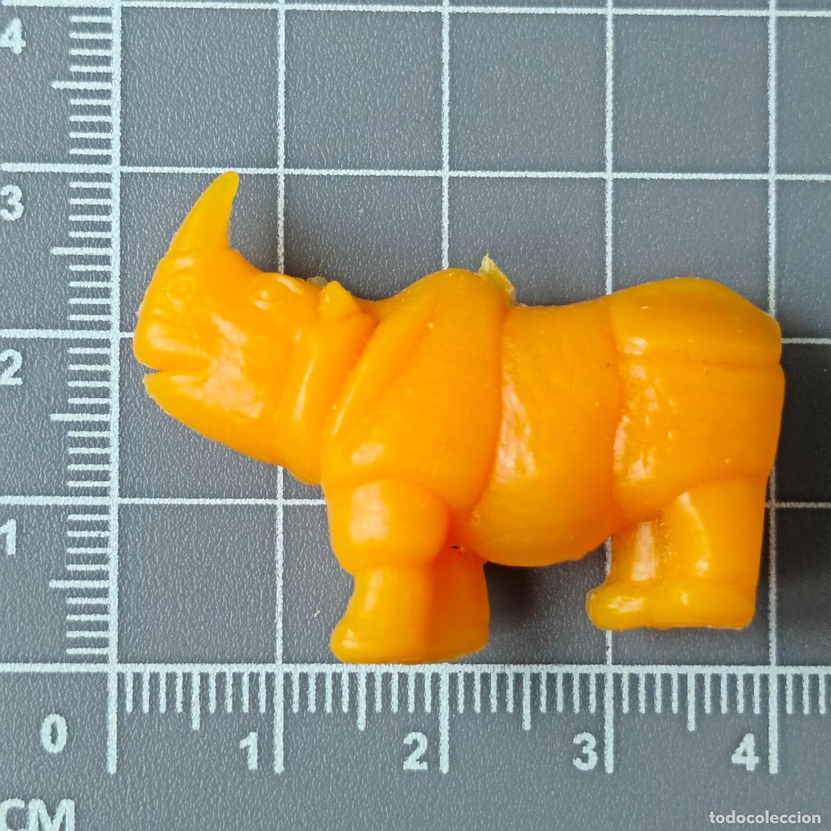Figuras de goma y PVC: figura mu&ntilde;eco promocional Dunkin fieras Zoo Rinoceronte Naranja