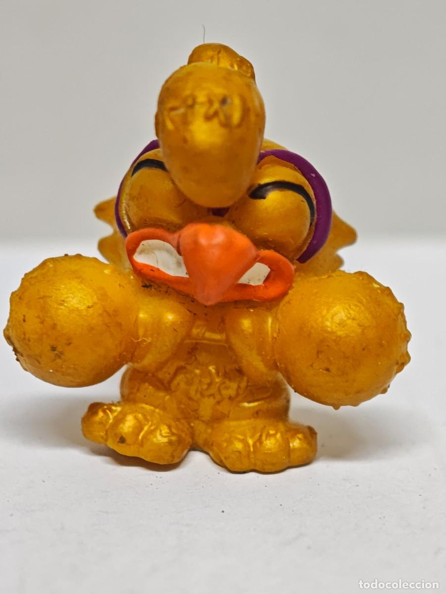 Figuras de goma y PVC: MU&Ntilde;ECO FIGURA ZOMLINGS DORADO NAGIX BOX