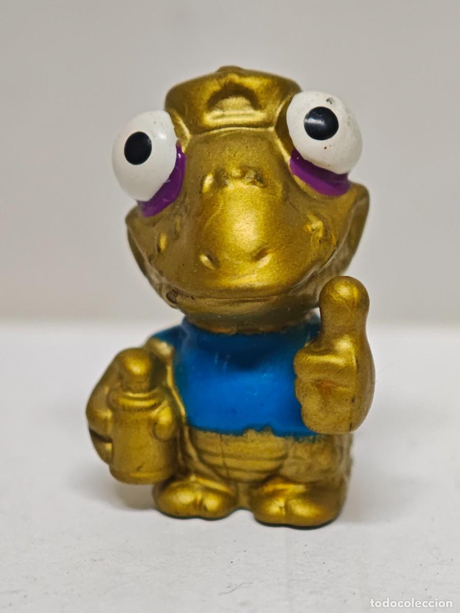 Figuras de goma y PVC: MU&Ntilde;ECO FIGURA ZOMLINGS DORADO NAGIX BOX