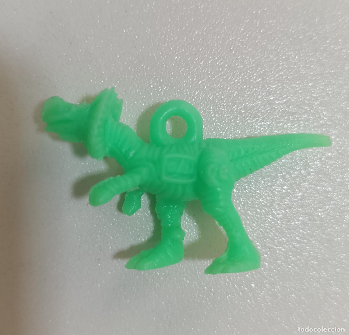 Figuras de goma y PVC: COLGANTE GREFUSA comansi JURASSIC PARK PARQUE JURASICO PREMIUM DUNKIN FIGURA color dilophosaurus