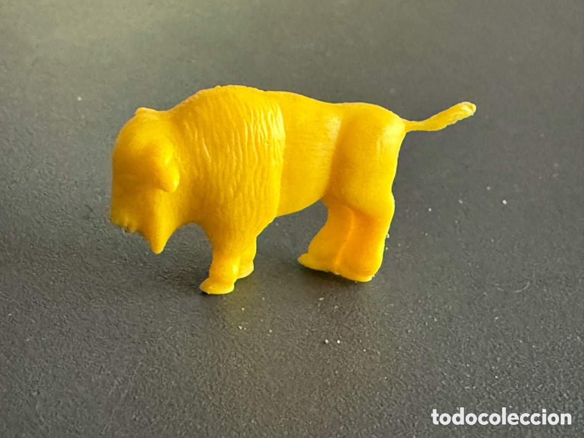 Figuras de goma y PVC: DUNKIN. BISONTE. Amarillo. PHOSKITOS