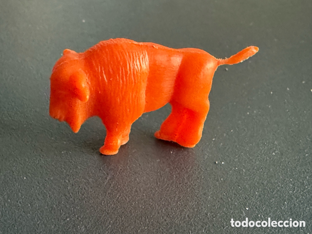Figuras de goma y PVC: DUNKIN. BISONTE. Naranja. PHOSKITOS
