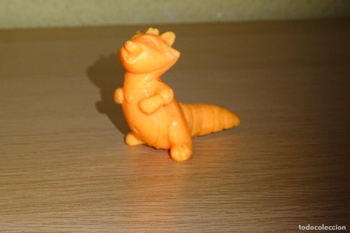 Figuras de goma y PVC: DINOSAURIO DIVERTIDO FABRICADO EN GOMA RIGIDA . 4 X 6 CMS APROX .