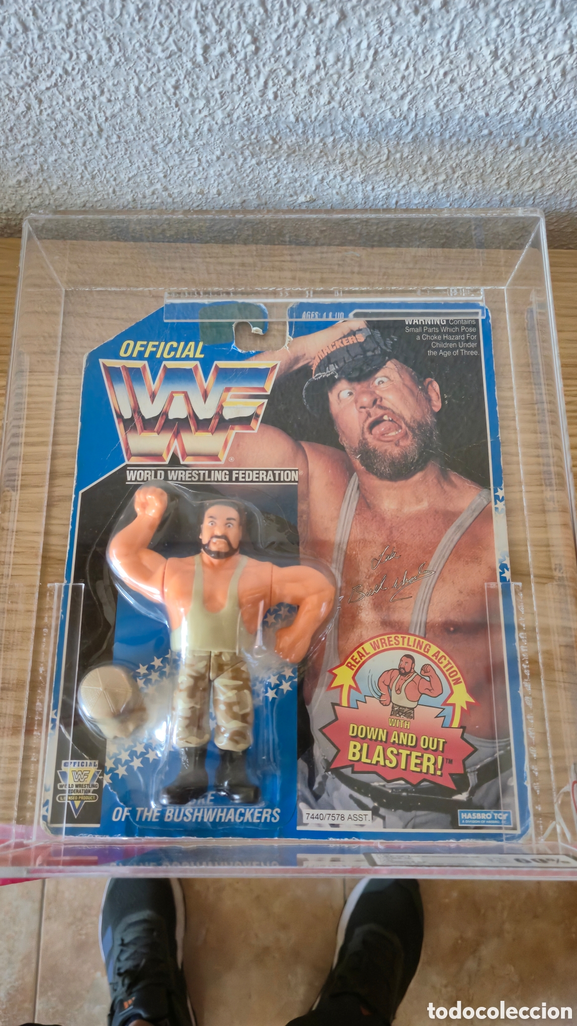 Figuras y Mu&ntilde;ecos Pressing Catch: Figura de luchador de pressing catch en blister Bushwackers graduado con un 60 y en blister de metac
