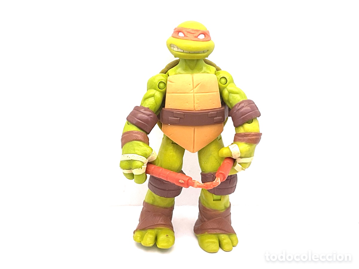 Figuras y Mu&ntilde;ecos Tortugas Ninja: Figura Articulada Personaje de las Tortugas Ninja. Michelangelo. A&ntilde;o 2012. Viacom.
