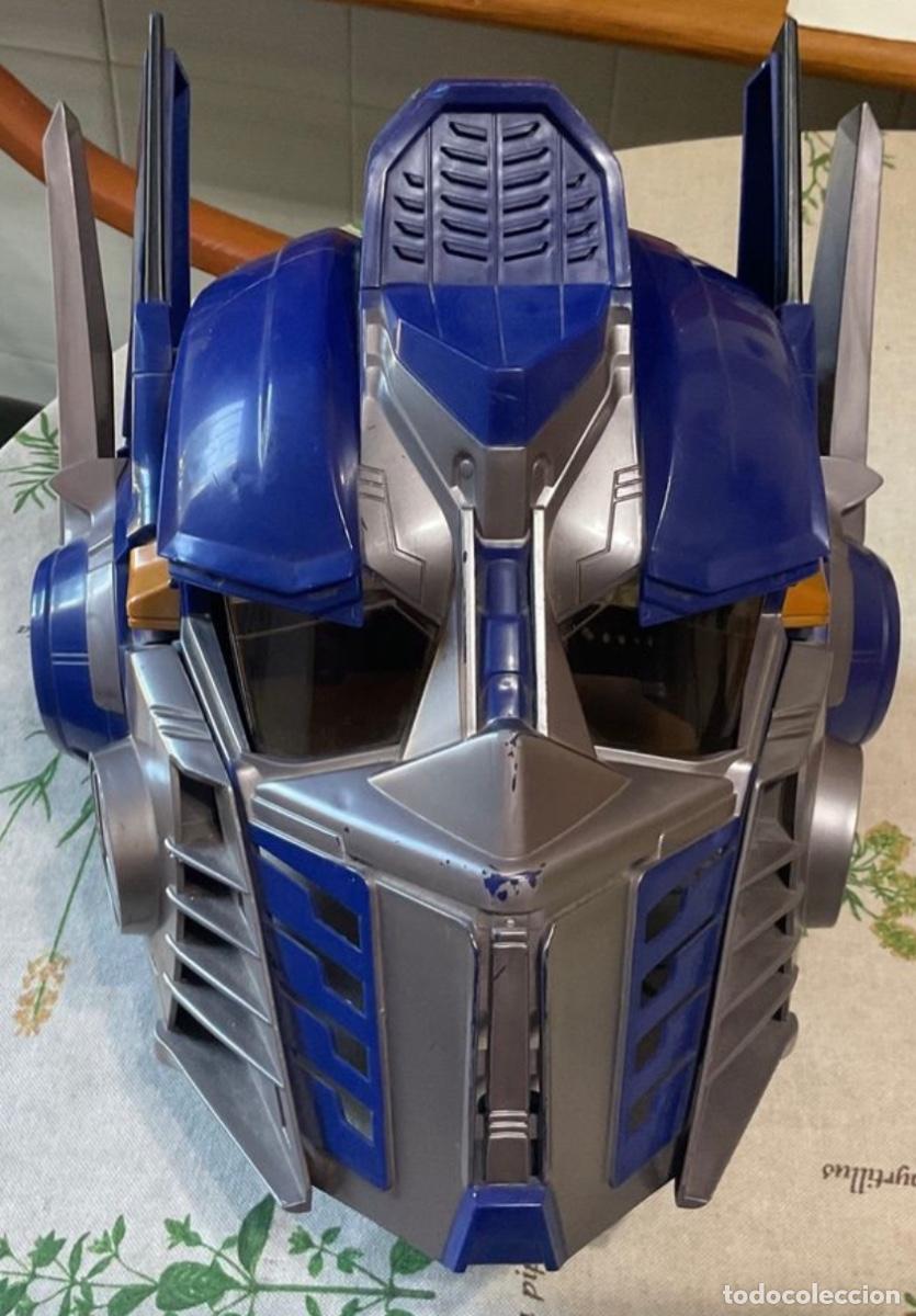 Figuras y mu&ntilde;ecos Transformers: Casco Optimus Prime, Tramsformer, azul y plateado con voz y efectos de sonido &ndash; Juguete interactivo