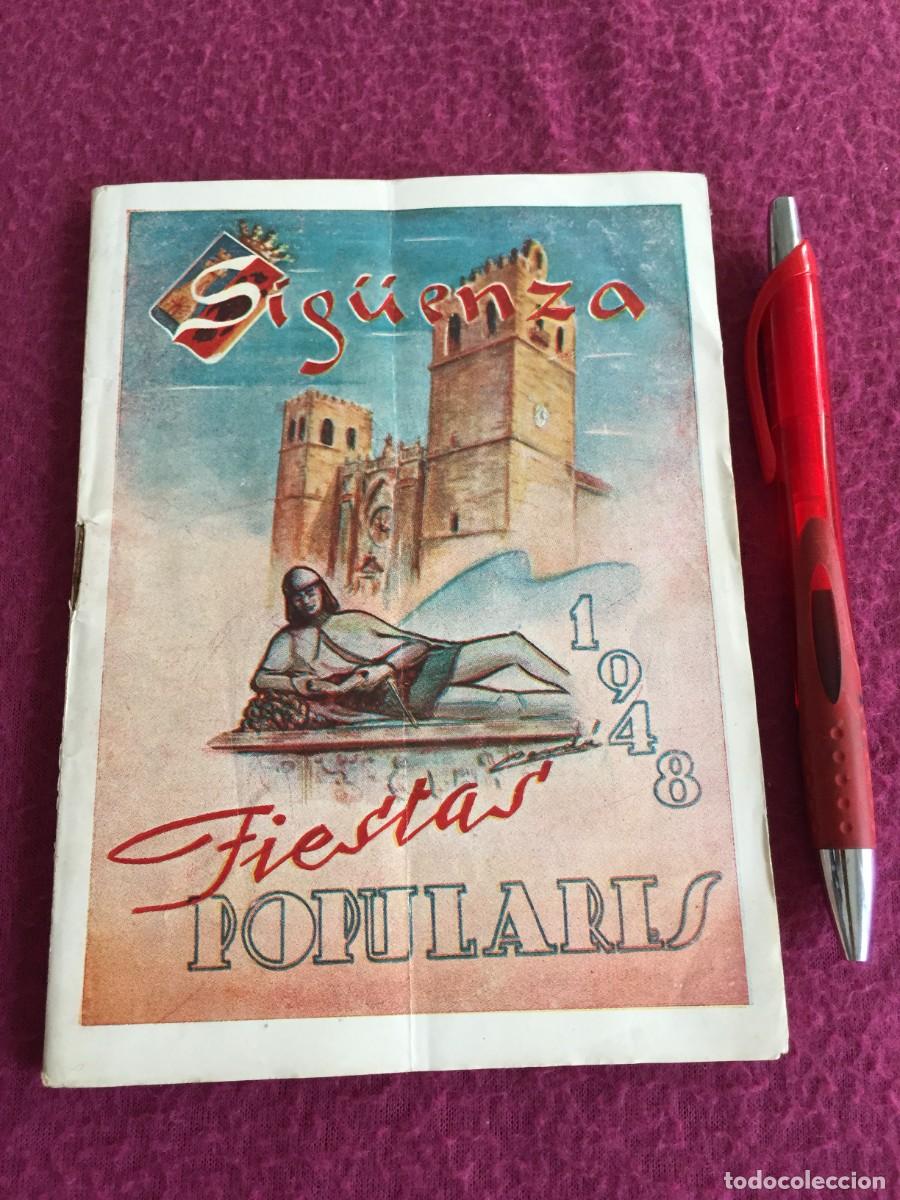 Folletos de turismo: Programa oficial de Sig&uuml;enza: Fiestas populares 1948 con mucha publicidad de la epoca