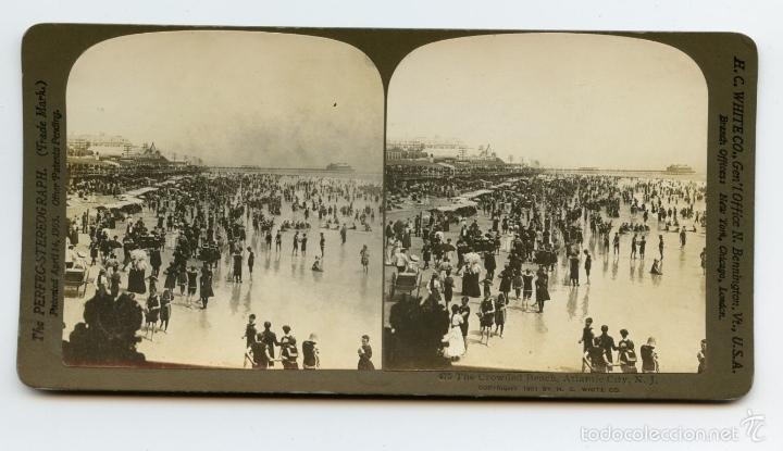 Fotografia antiga: Playa abarrotada, Atlantic City. U.S.A.  H.C. White Co., Gen'l Office N. Bennington, Vt., U.S.A.  Br