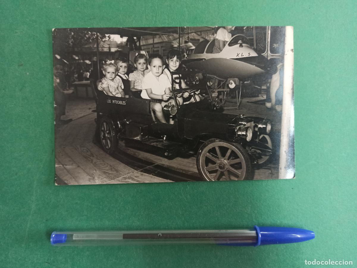 Fotograf&iacute;a antigua: Antigua fotografia de ni&ntilde;os en tiovivo. Fotografia de Sabadell. Tio vivo. Feria.