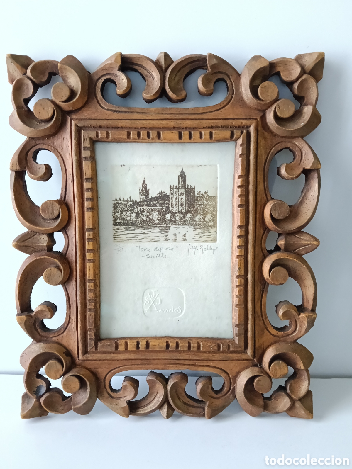 Fotograf&iacute;a antigua: Grabado de torre del Oro en marco de madera.