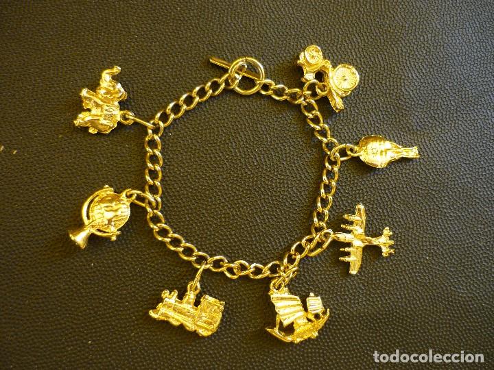 Joyeria: PULSERA DORADA CON MOTIVOS TRANSPORTES. - Foto 1