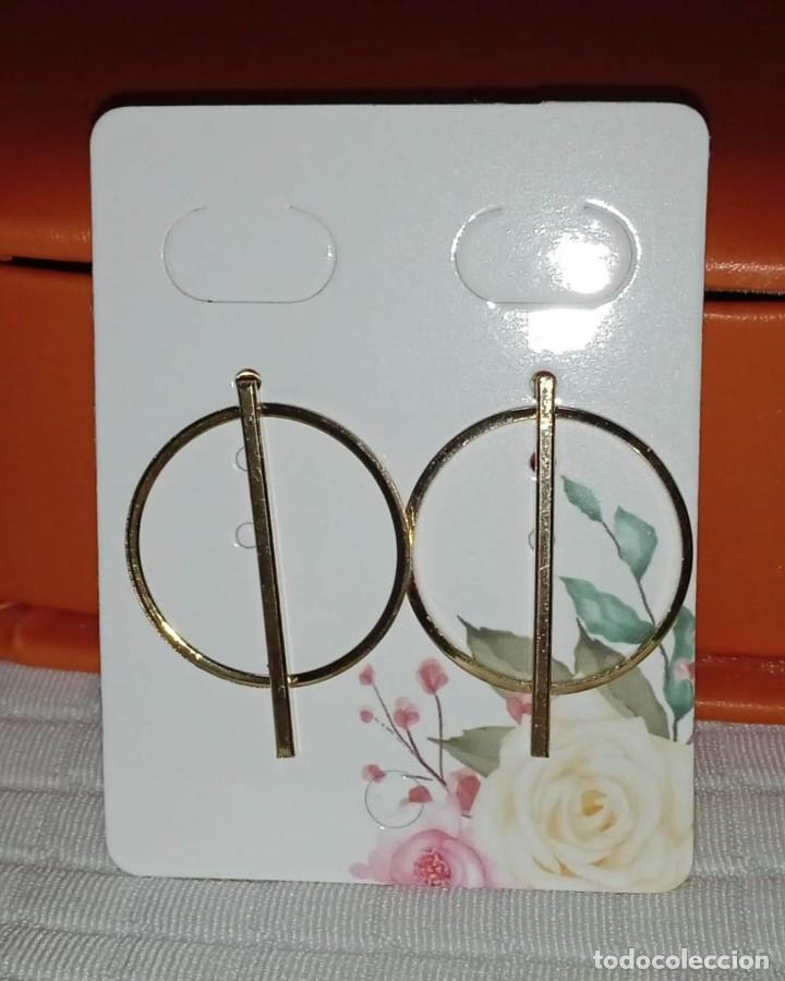 Joyeria: PENDIENTES S&Iacute;MBOLO DORADO BISUTER&Iacute;A - Foto 1