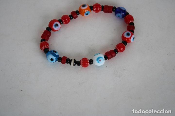 Joyeria: pulsera elastica con cuentas de cristales ojo turco - Foto 1