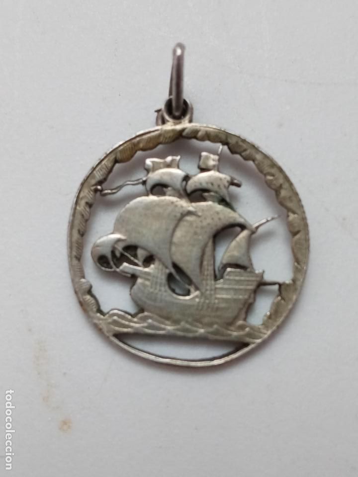 Joaillerie: Colgante moneda Portugal de plata con barco calabera