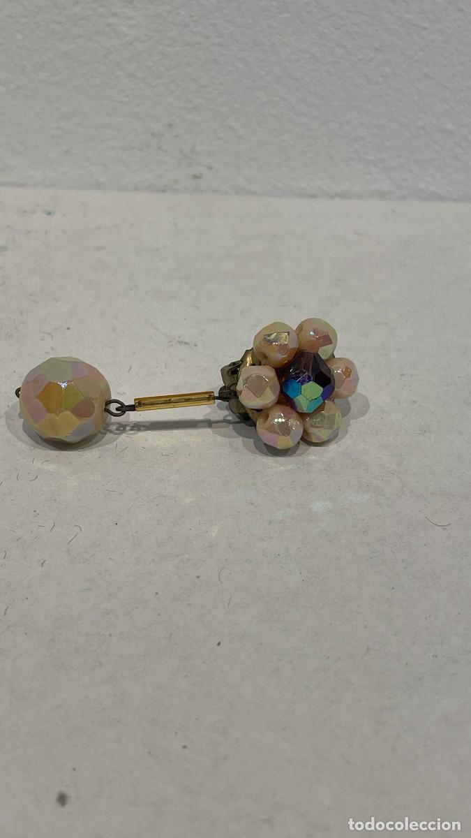 Joyeria: PENDIENTE DE FLOR CON PIEDRAS TORNASOL