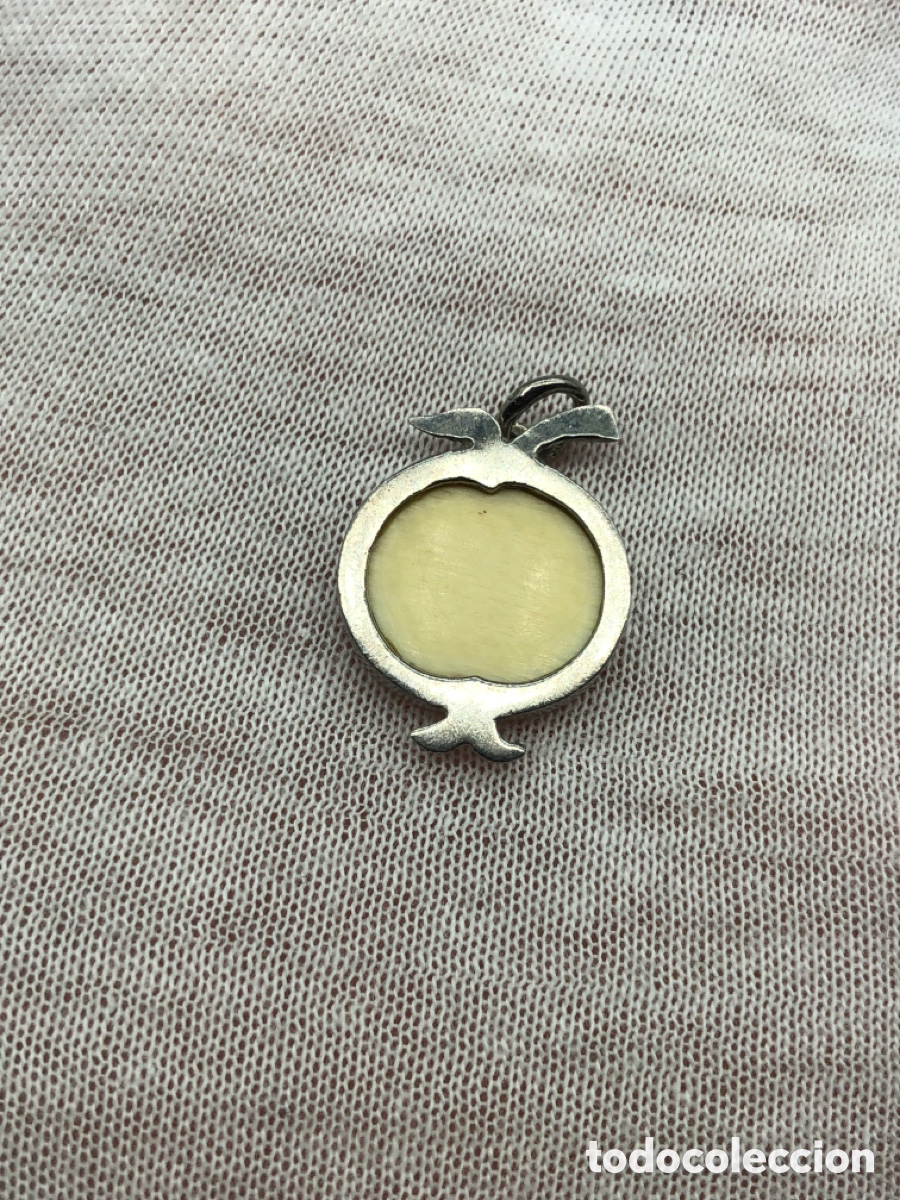 Gioielleria: Antiguo colgante de plata y marfil