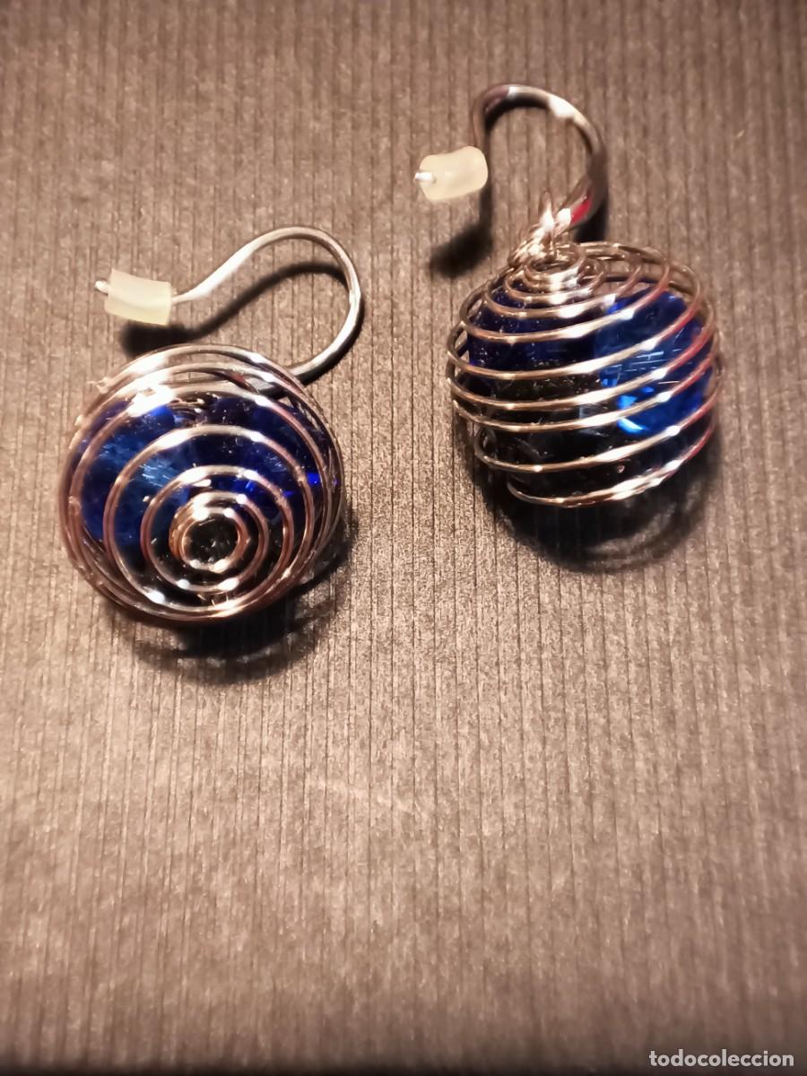 Gioielleria: Pendientes de espiral con piedras azules