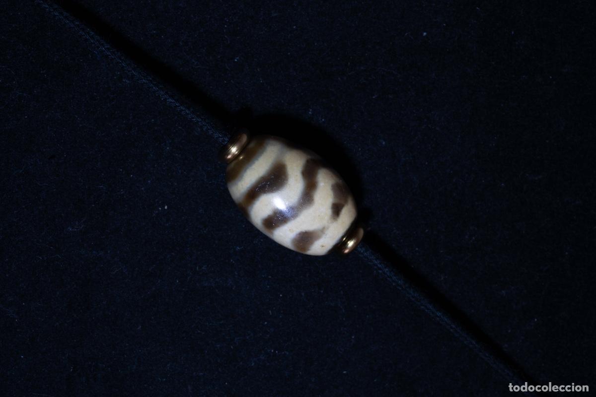 Schmuck: Dzi tibetano de ondas de agua de la tradici&oacute;n budista china