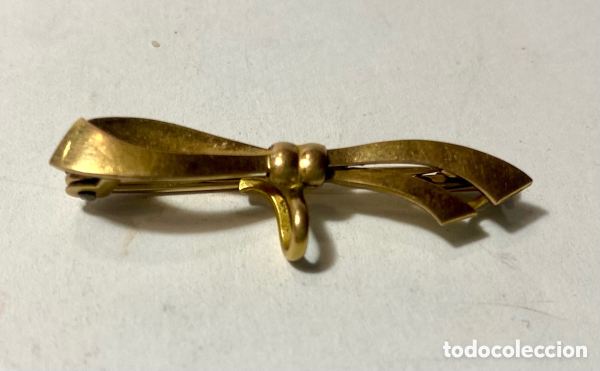 Joyeria: Broche en forma de lazo metal dorado - Foto 2