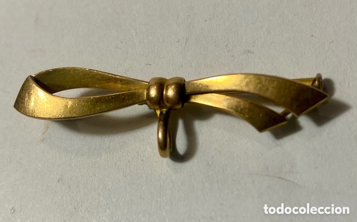 Joyeria: Broche en forma de lazo metal dorado - Foto 1