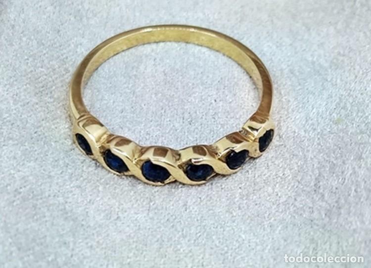 Joyeria: ANILLO MEDIA ALIANZA DE ORO LEY 18 QUILATES Y SEIS ZAFIROS AZULES NATURALES DE 0,48 CTS.