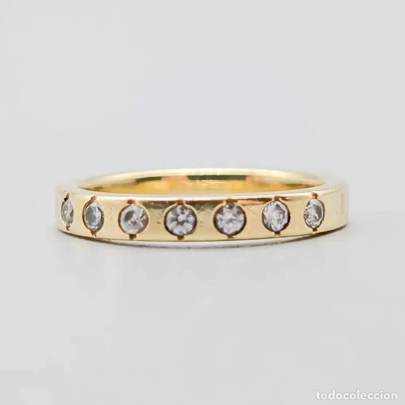 Joalharia: Anel em ouro amarelo com pedra azul e diamantes em ouro 18 quilates, 6,22 gramas, 17,25mm