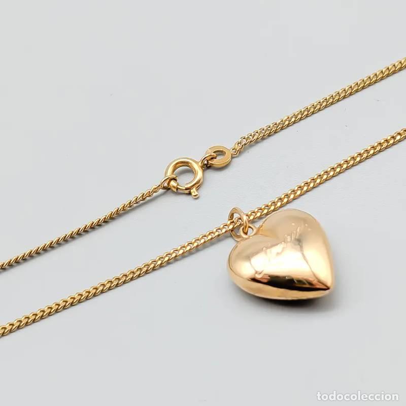 Joalharia: Broche em ouro 14 quilates com p&eacute;rolas e pedra roxa, 3,88 gramas, 42mm