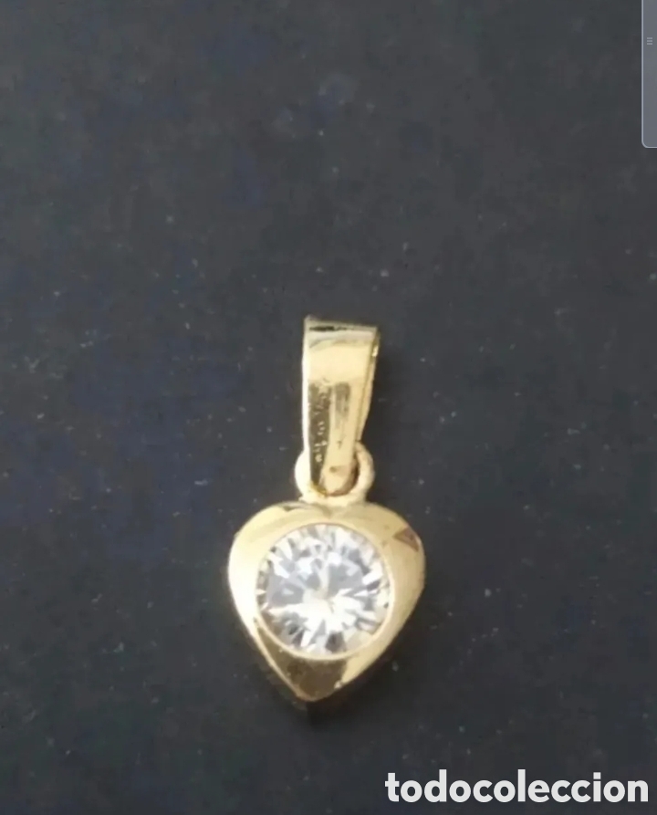 Jewelry: COLGANTE DE ORO DE 18 KILATES.