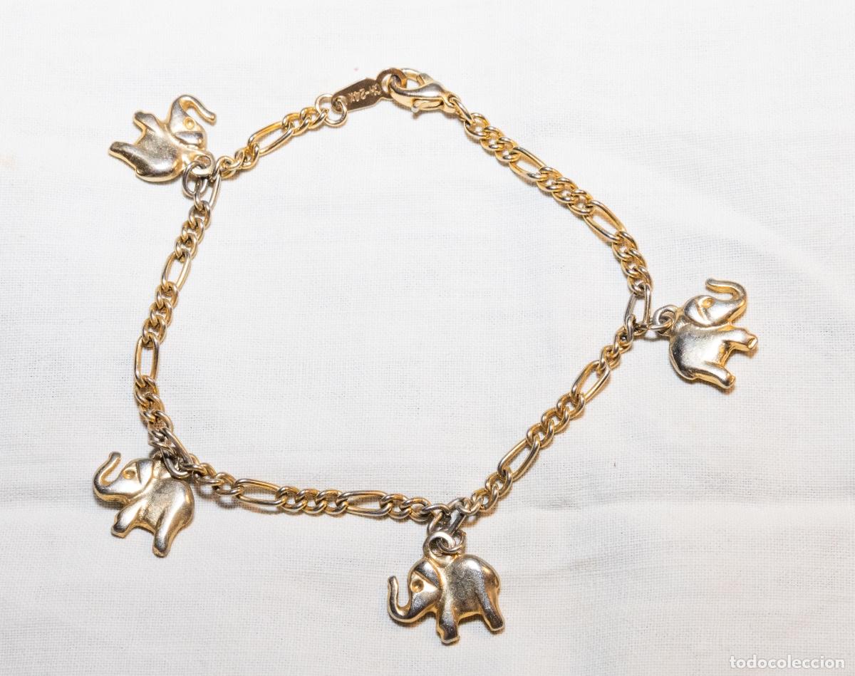 Jewelry: Pulsera vintage de elefantes chapado en oro 24k, con cadena tipo figaro y colgantes decorativos