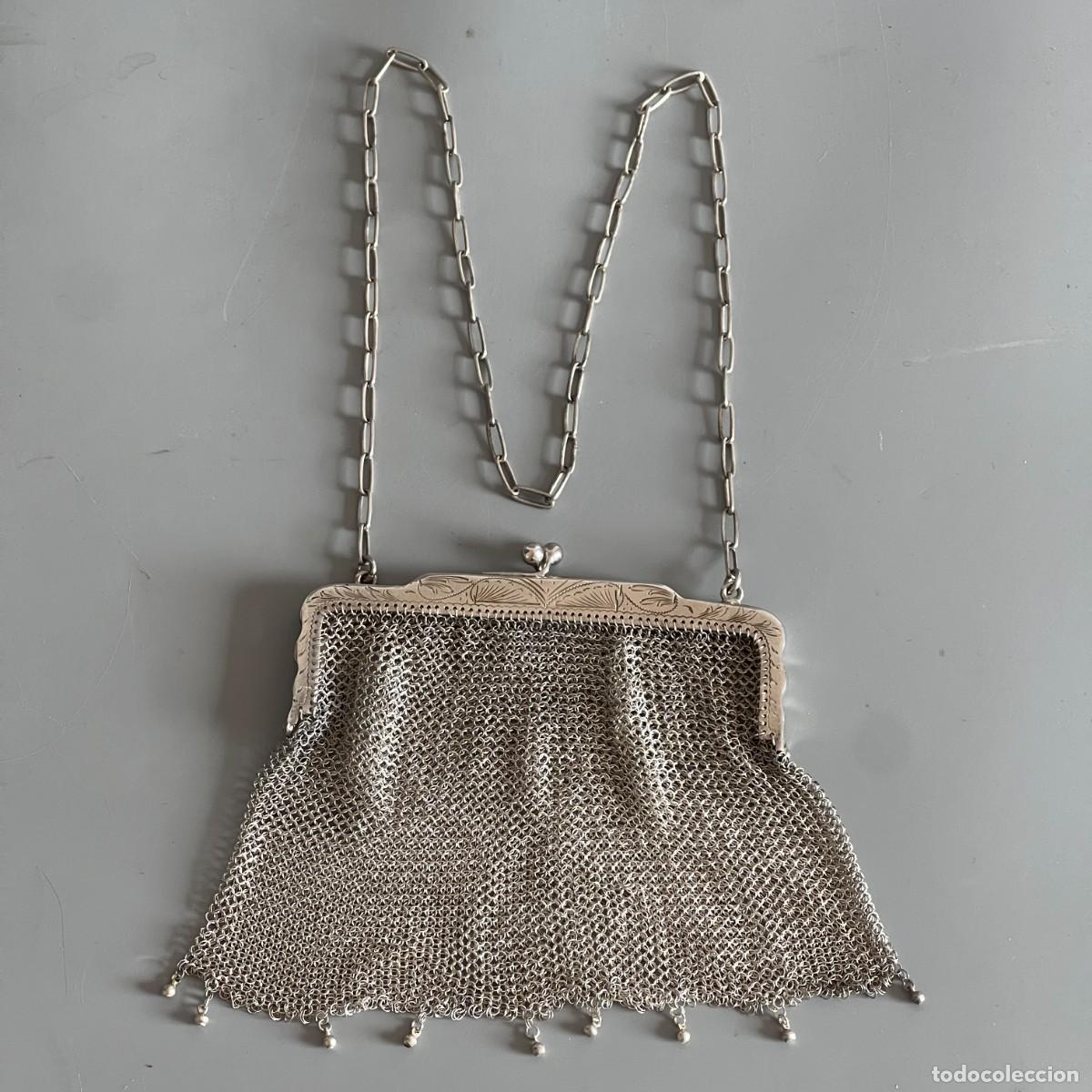 Joyeria: Bolso decorado de malla en plata 800 con cadena de 40 cm de largo y 112 gr.