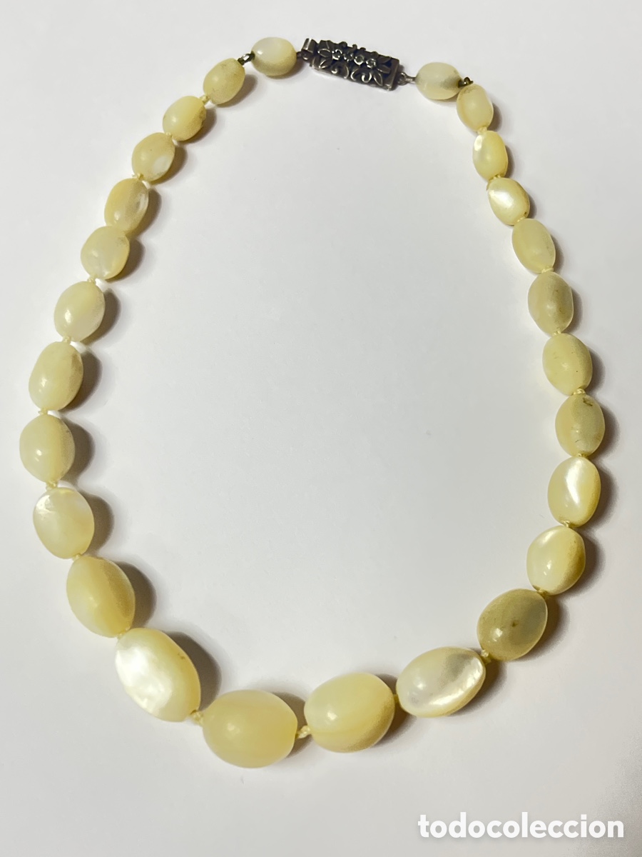 Joaillerie: Collar de plata y n&aacute;car COLL17