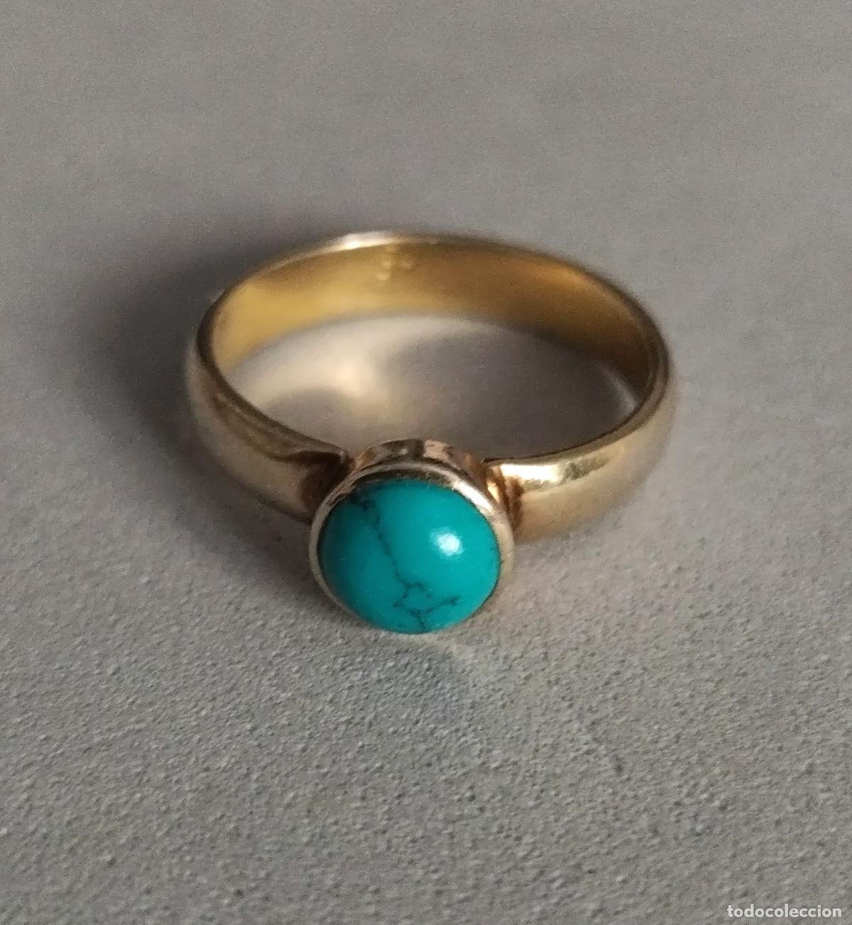 Joyeria: Anillo plata de ley, con ba&ntilde;o de oro, con piedra azul.