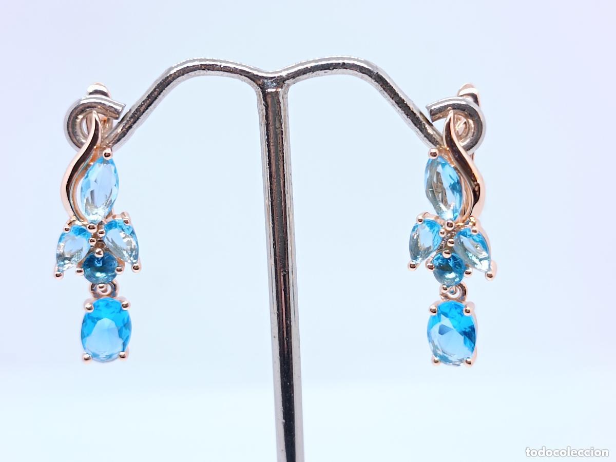 Joyeria: Elegantes pendientes en oro de 14k contrastados con aguamarinas
